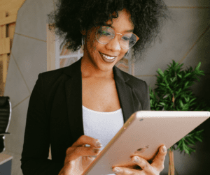 A woman looks at an iPad.