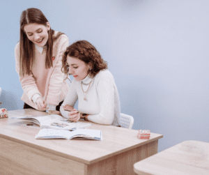 Two female RBTs study together