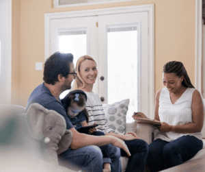 Parents and child meet with clinician during ABA assessment